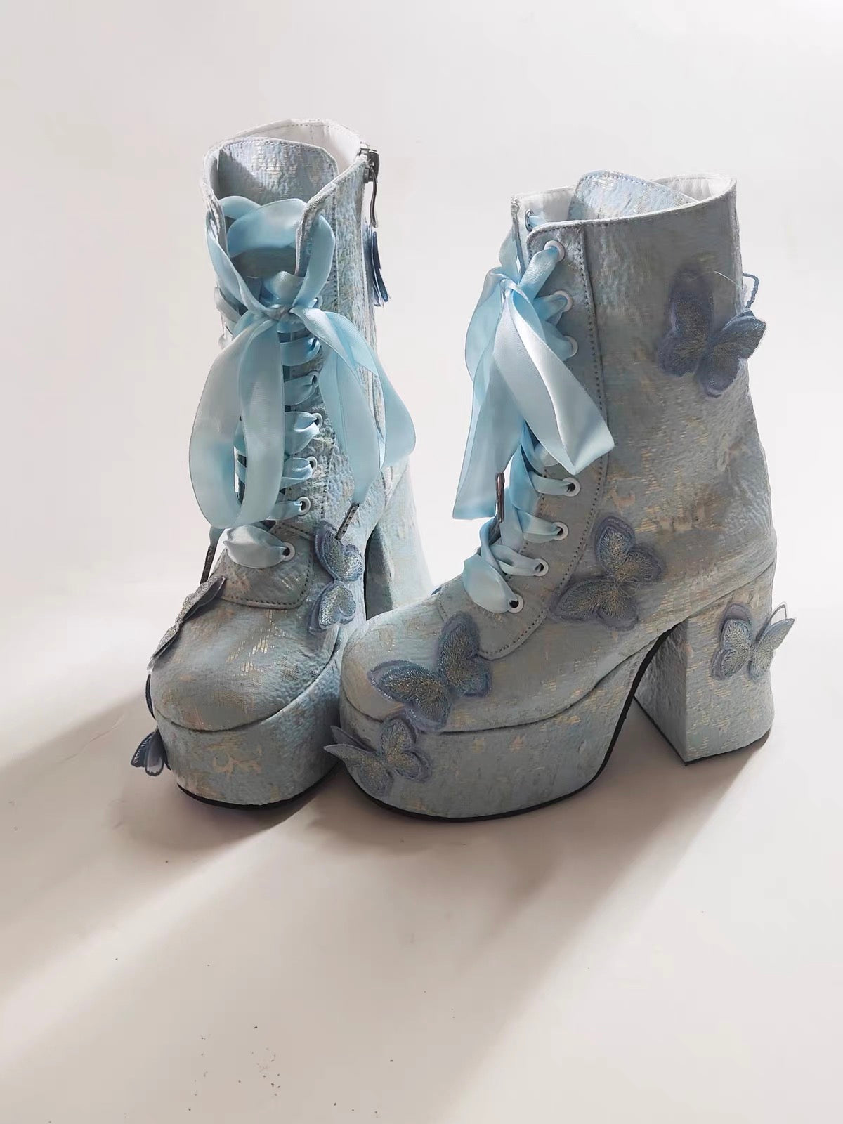 Blue butterfly platform boots product view