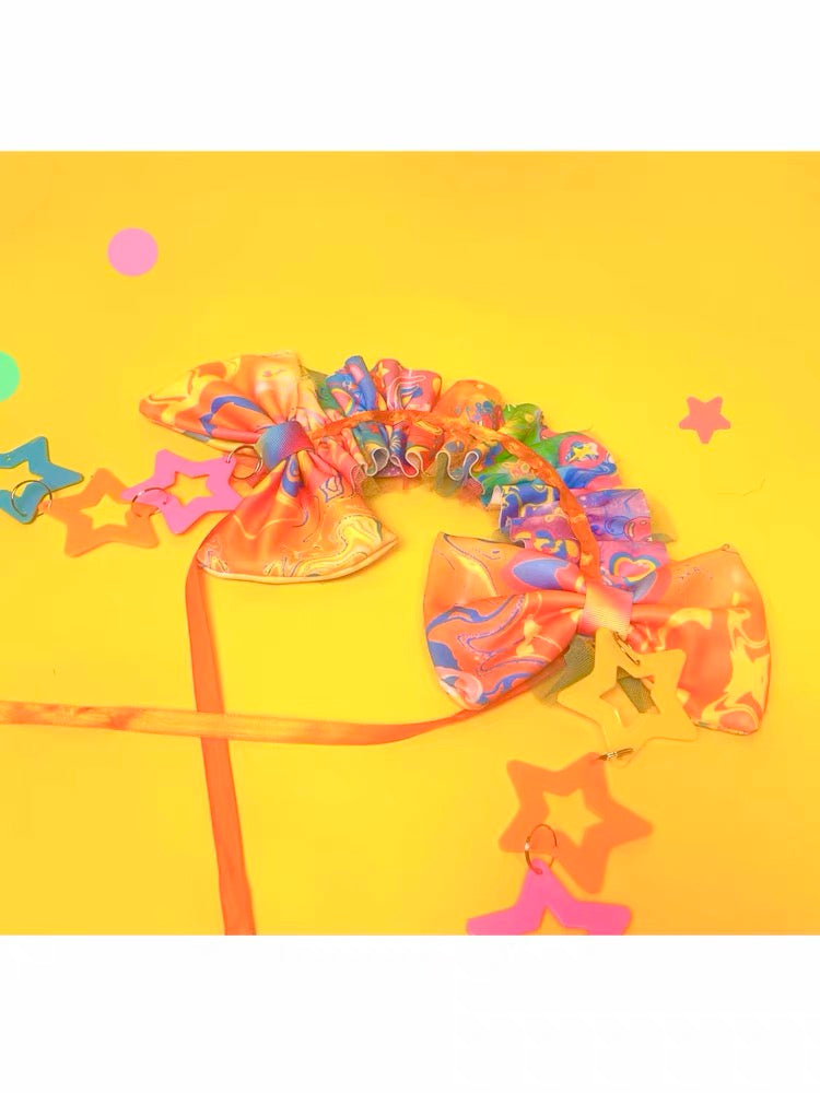 Decora ruffle headpiece with large bows and colorful star charms