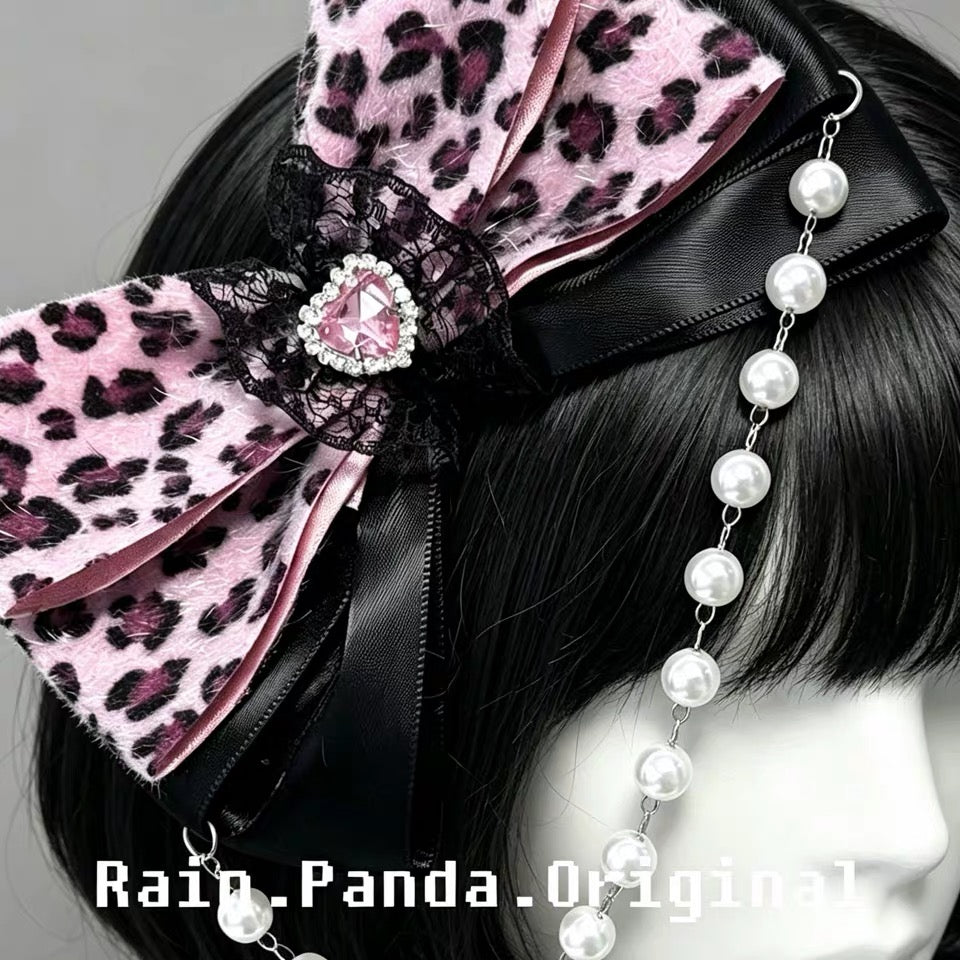 Pink leopard bow hair clip detail with heart gem and pearl chain