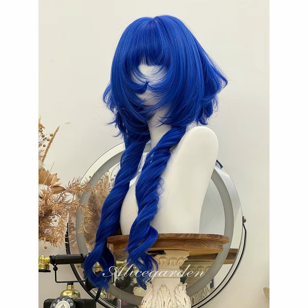 Cobalt blue layered wig side view with long spiral sections