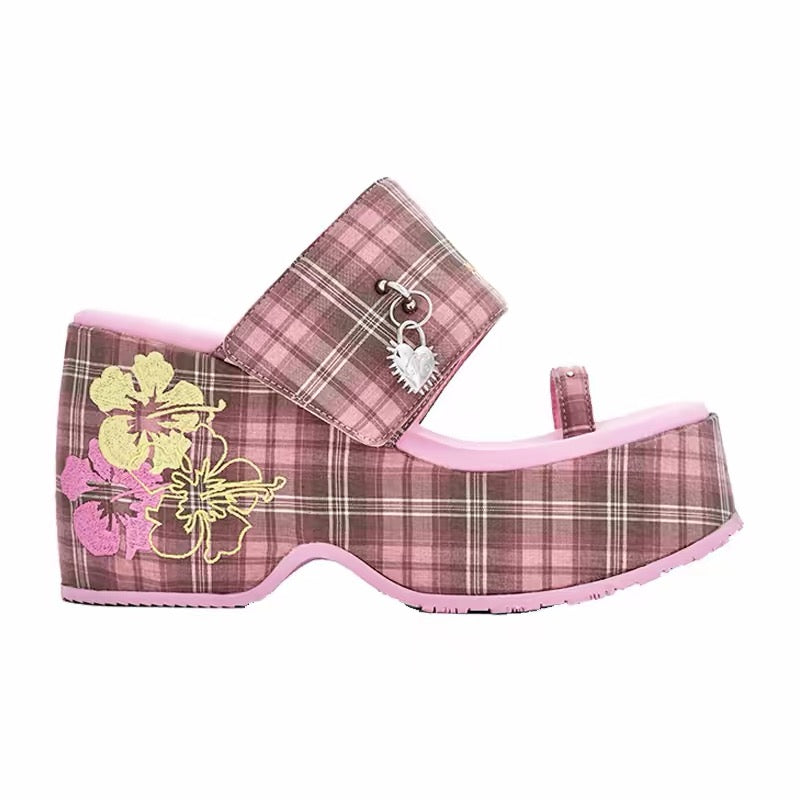 Side view of pink plaid platform sandals with floral embroidery