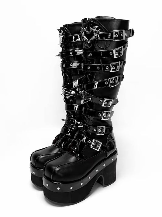 Black knee-high platform boots with multiple buckles and metal hardware