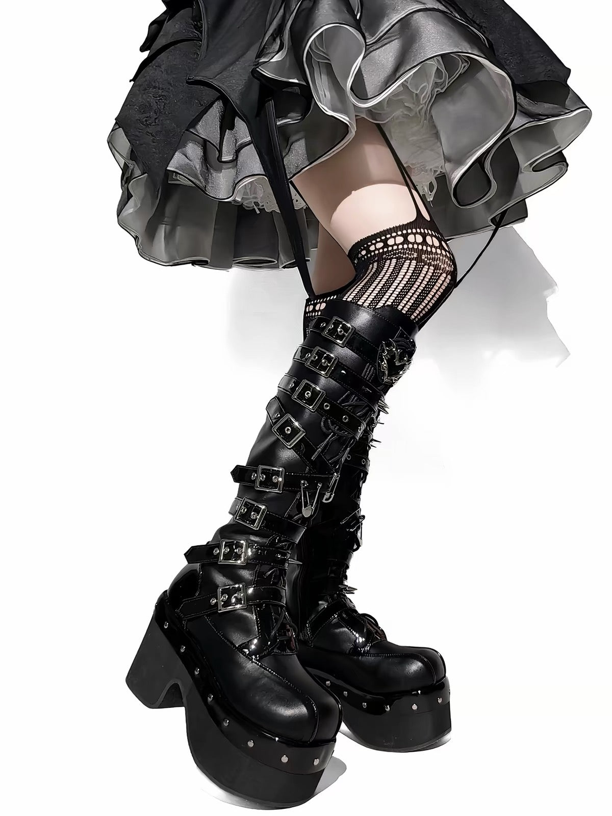 Black knee-high platform boots styled on model