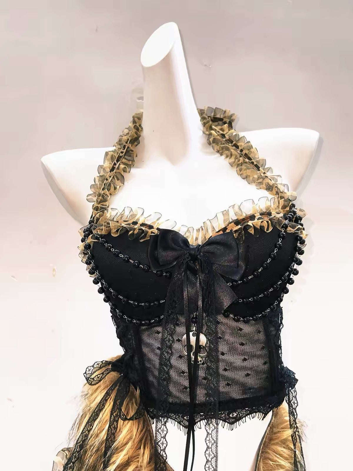Black lace halter top with bow, bead draping and skull detail