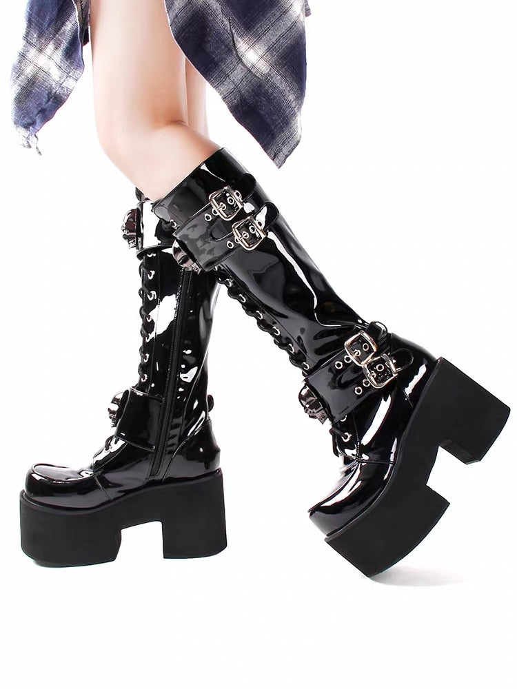Black patent knee-high platform boots angled view
