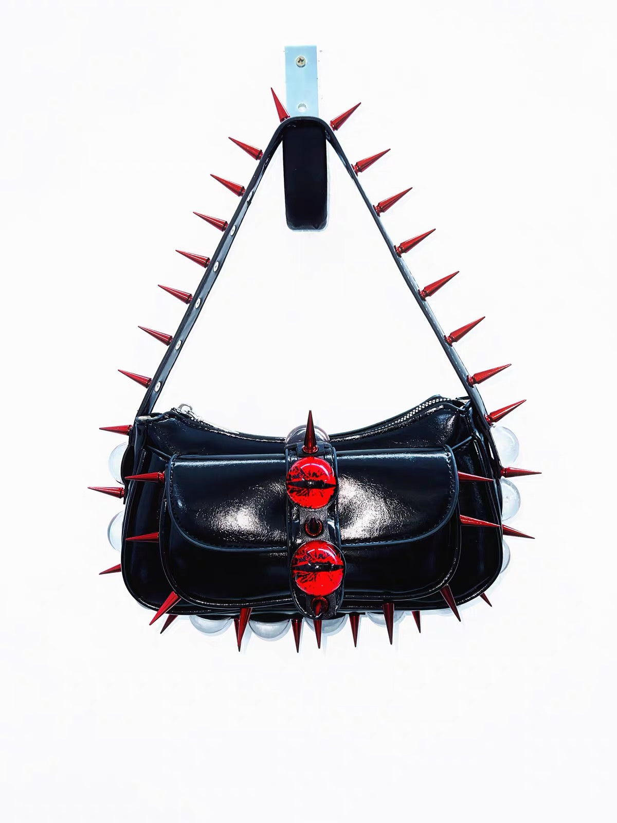 Black patent spiked shoulder bag front view