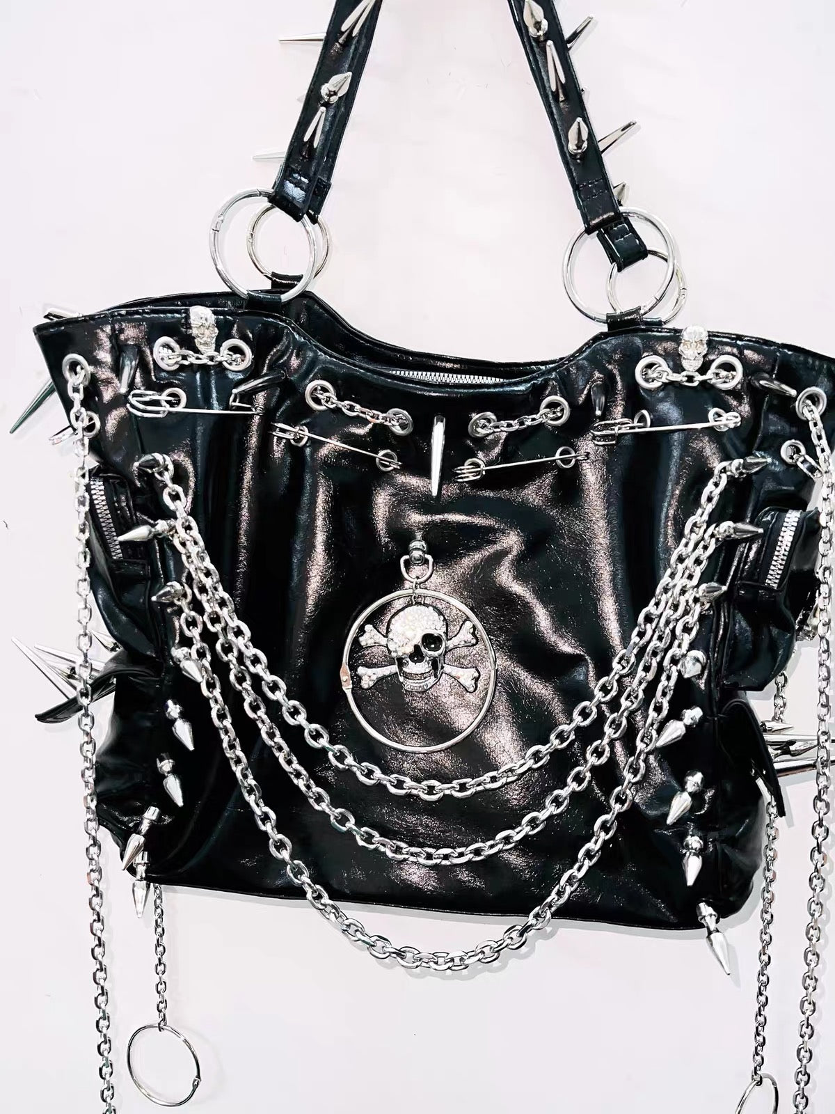Black spiked chain skull handbag close-up