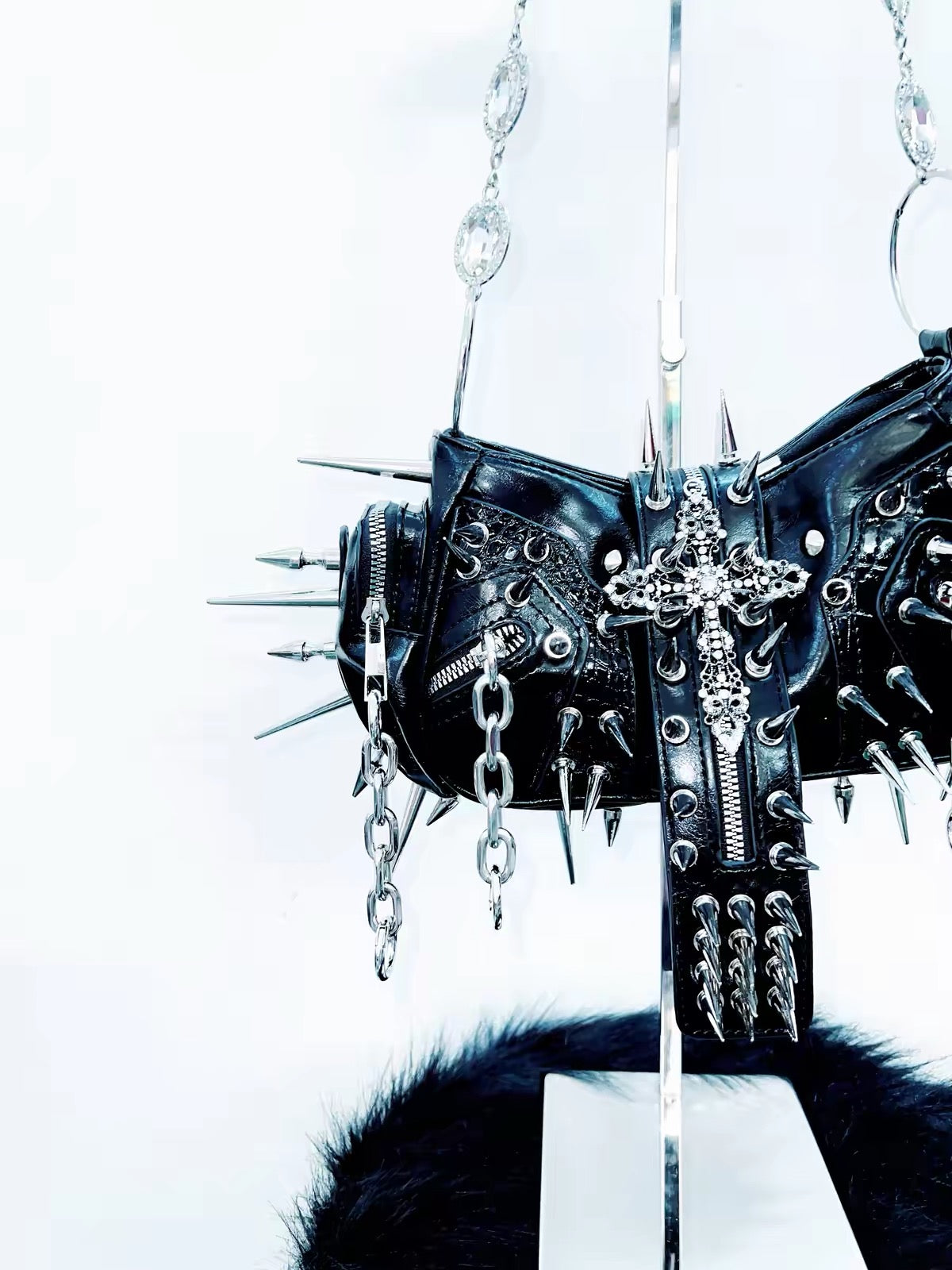 Black spiked cross handbag detail view