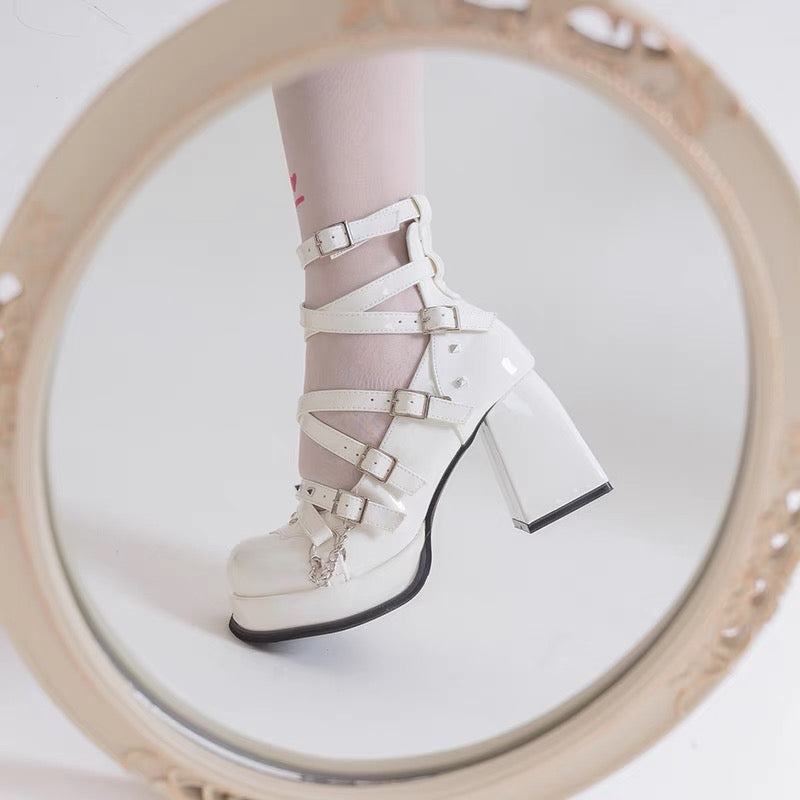 Black strappy platform heels with buckles