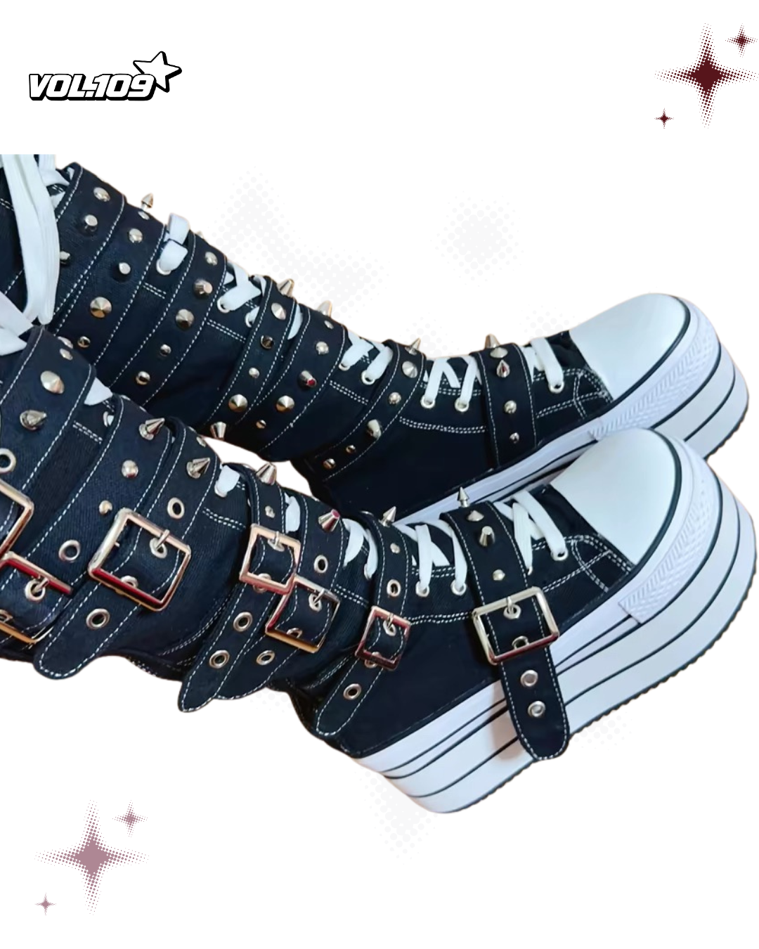 Side view of black and white platform boots with white laces, silver buckles and studs