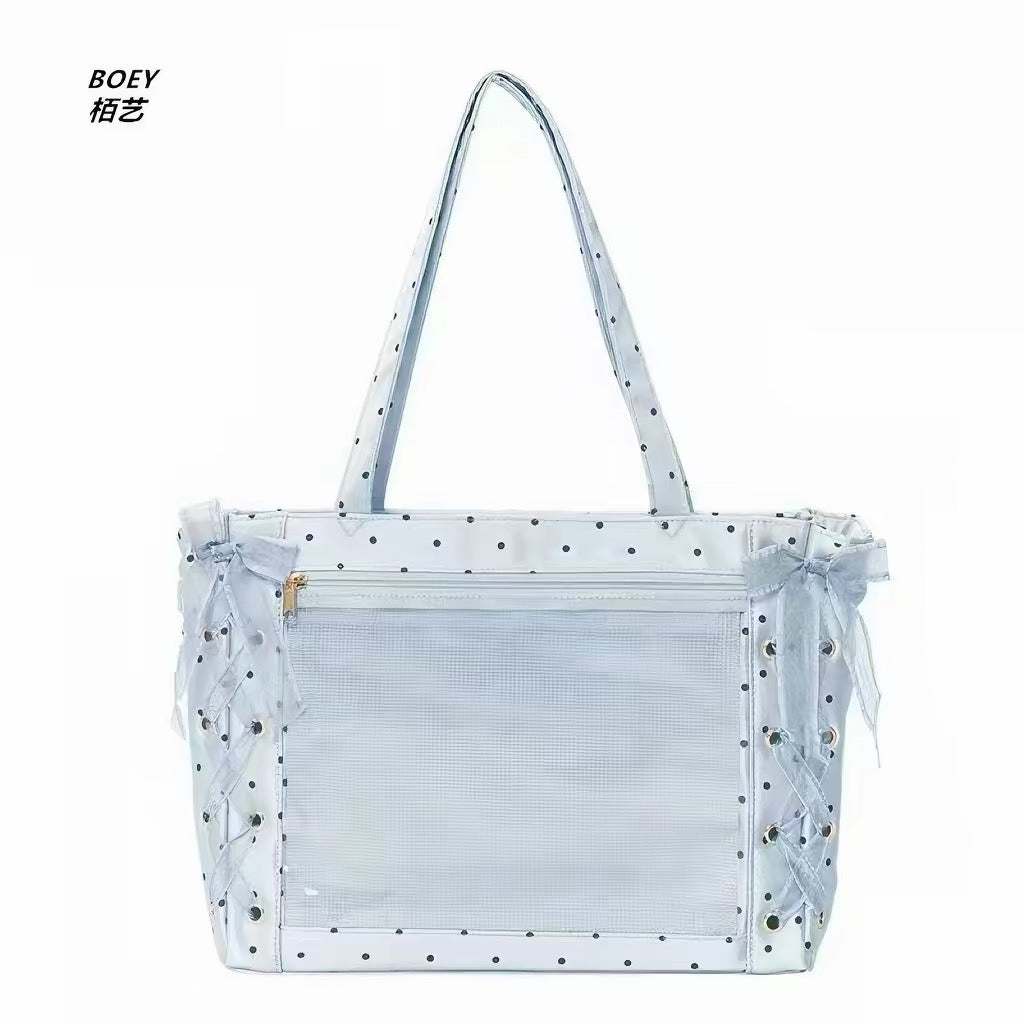 Blue polka dot ita bag with clear display pocket and lace-up ribbon sides