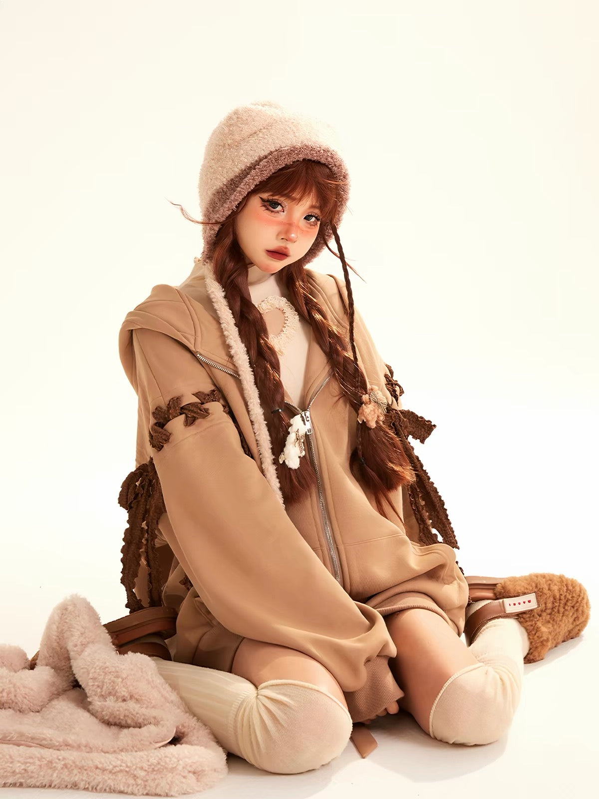 Brown oversized hoodie with bow details and fuzzy trim
