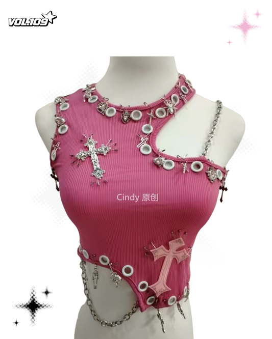 Pink asymmetric ribbed crop top with silver cross charms, eyelets and chain details