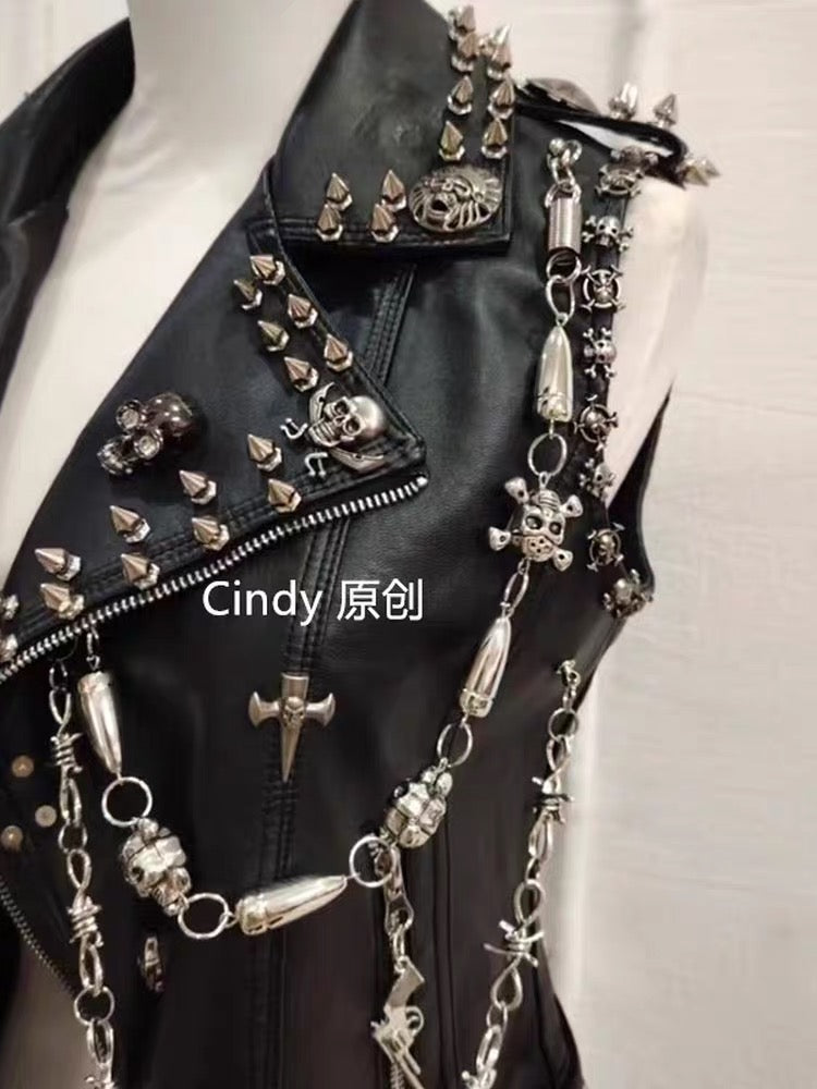 Close-up of black vest with spikes skull hardware and silver-tone chains
