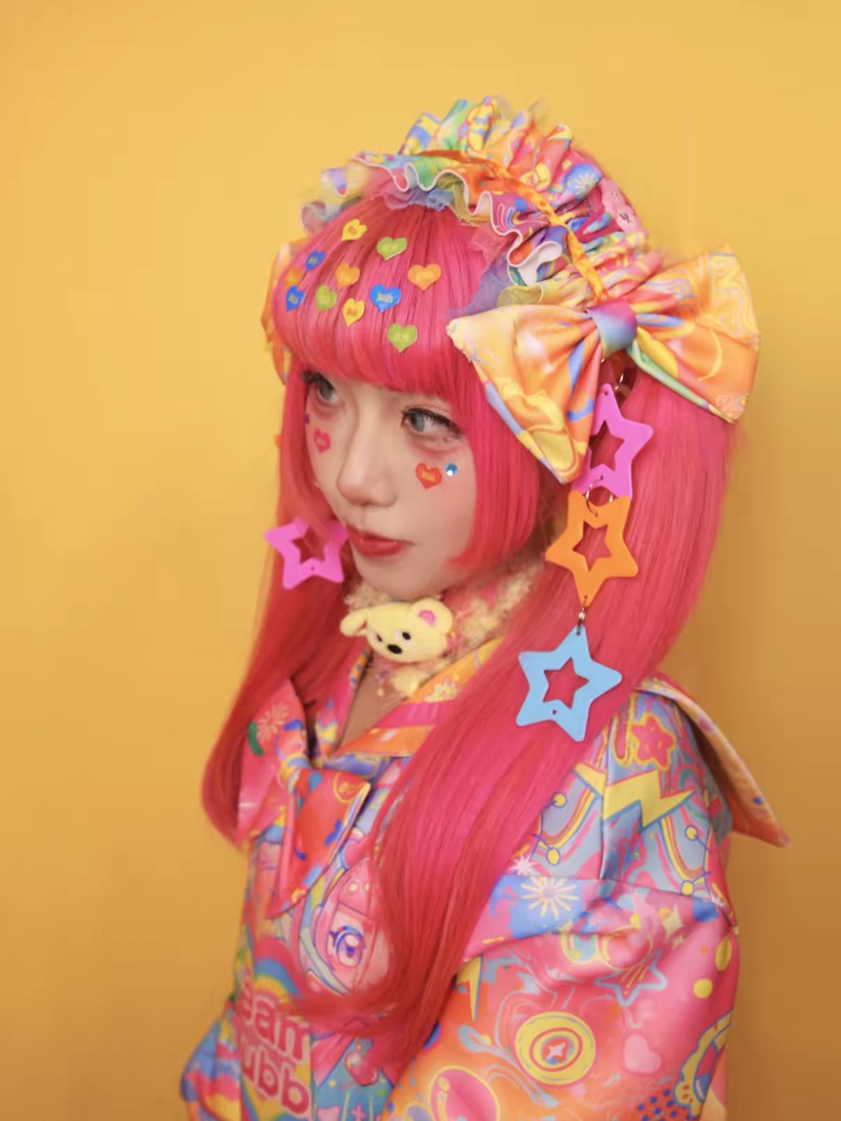 Decora rainbow star headpiece styled with pink hair