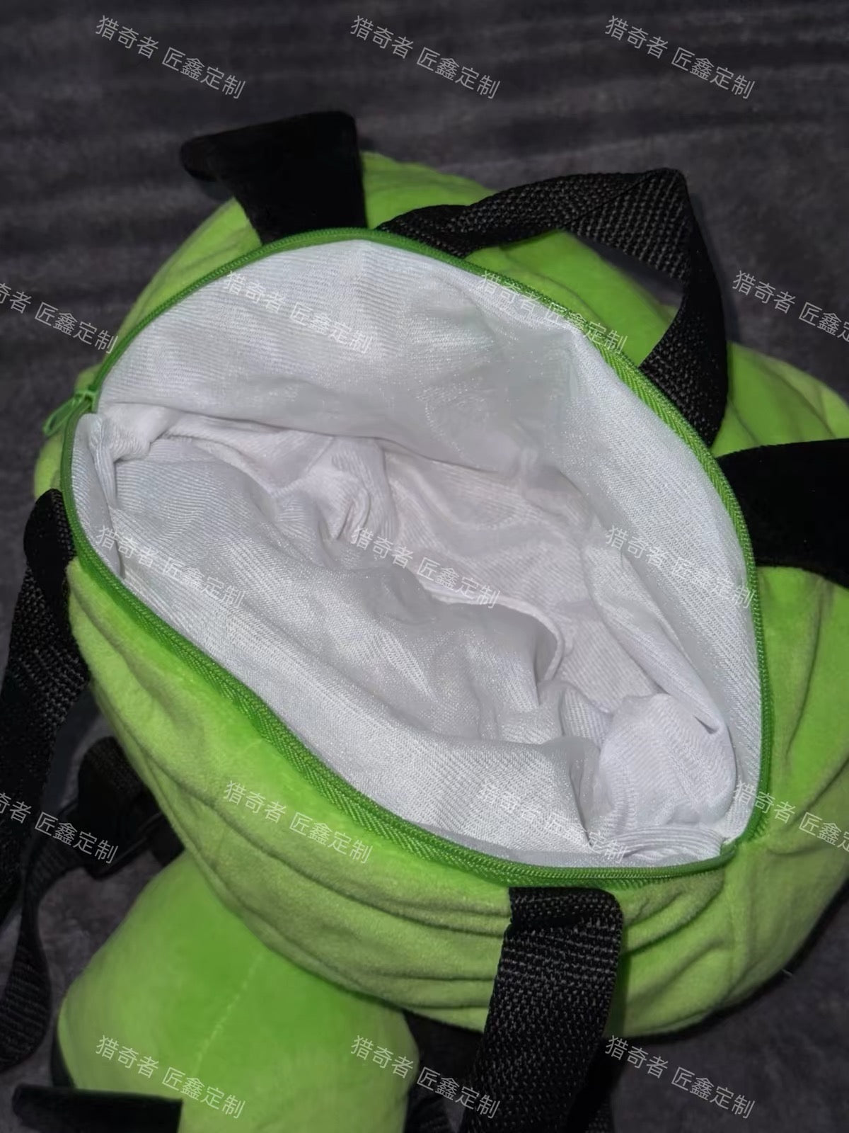 Green plush character backpack interior