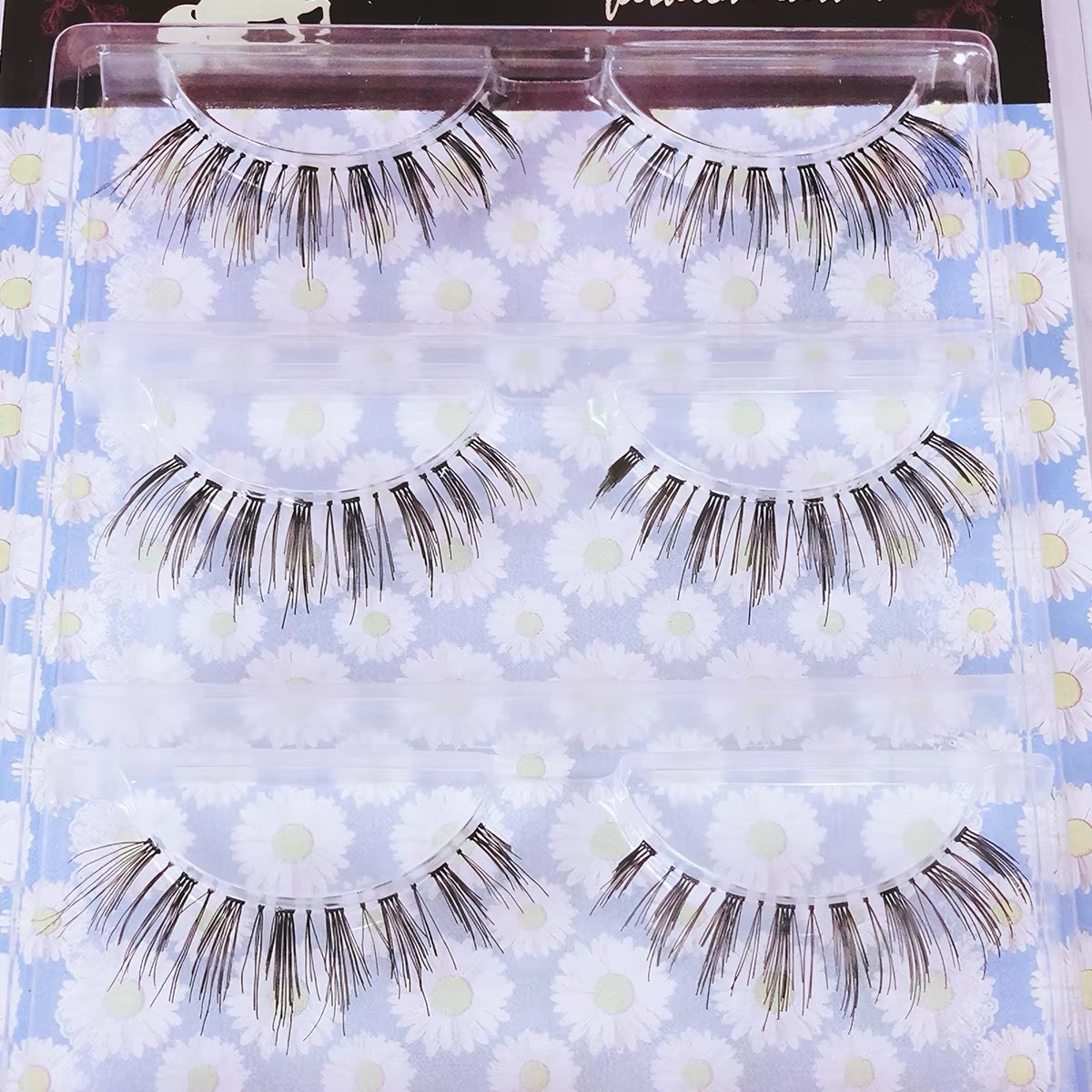 Three pairs of lower false lashes in floral tray
