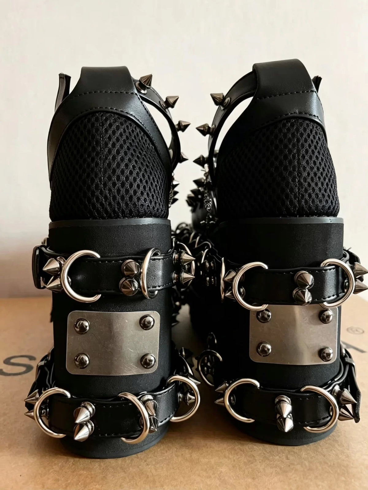 Black heavy spiked platform sandals back view