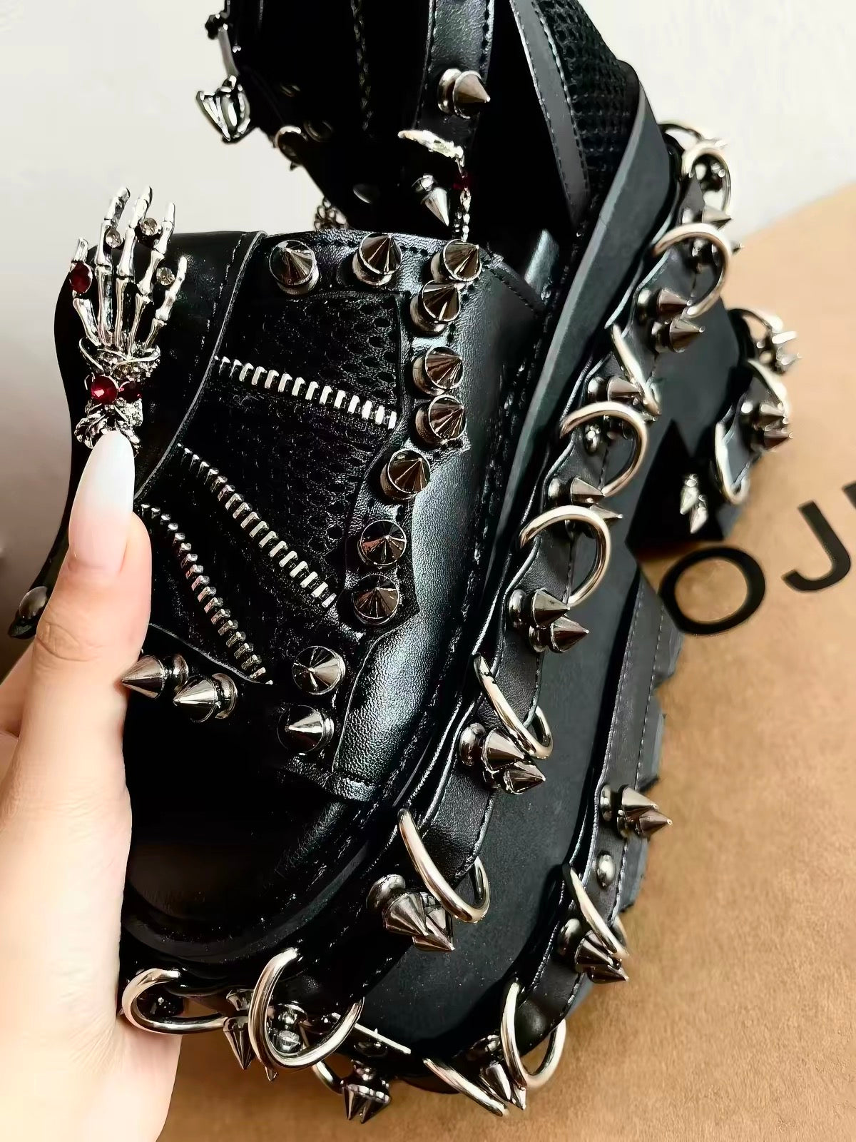 Black heavy spiked platform sandals side hardware detail