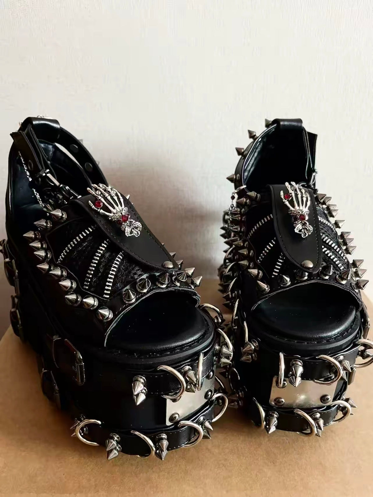 Black heavy spiked platform sandals front view