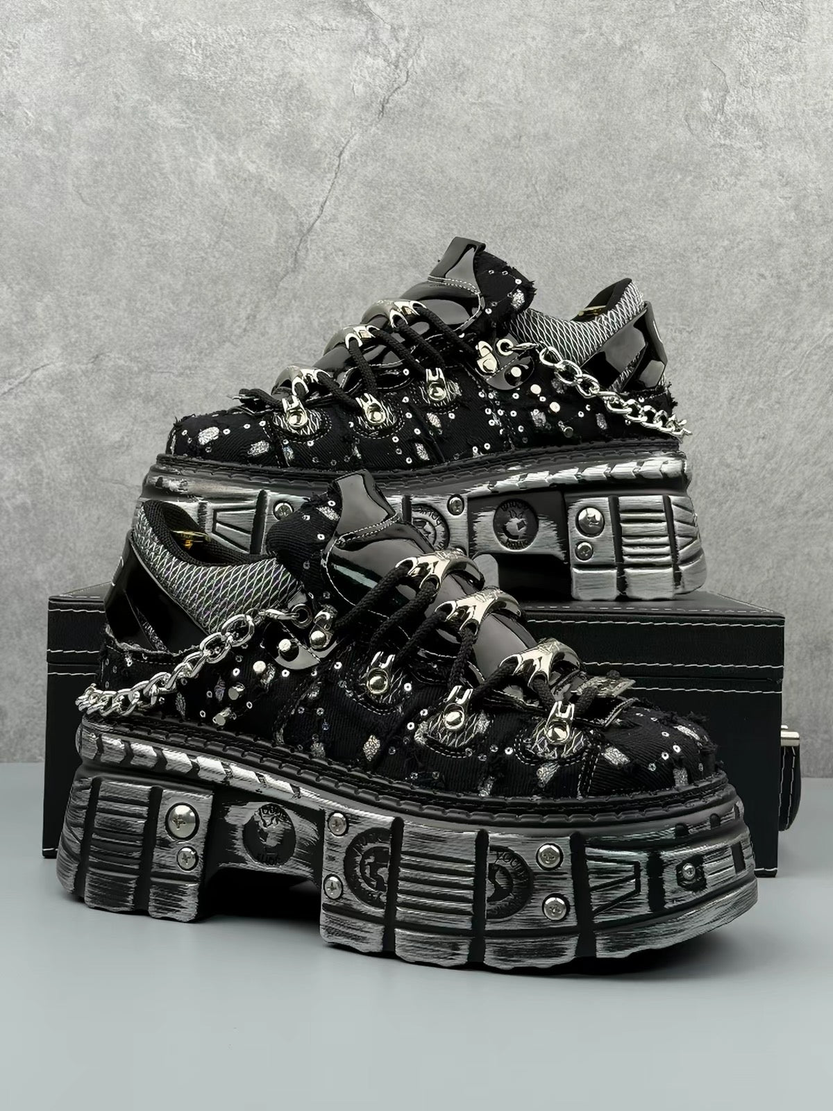 Black industrial platform sneaker with silver hardware