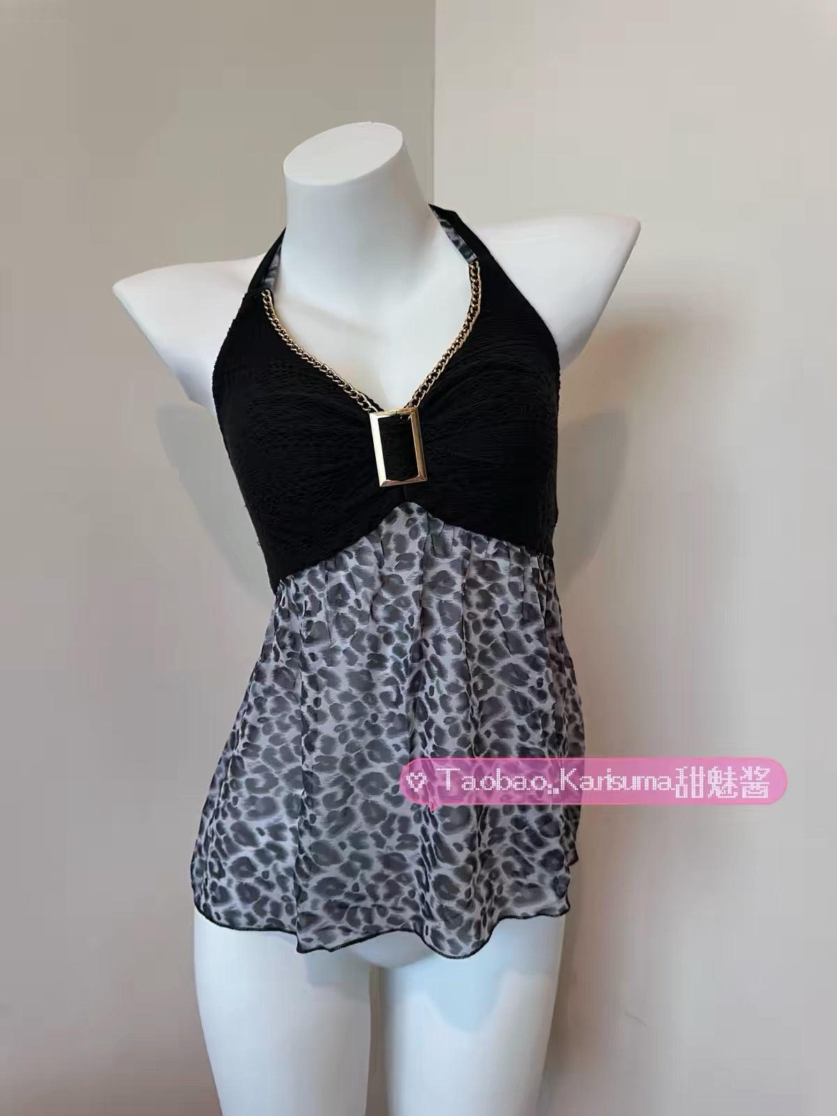 Karisuma leopard-print halter top with a black gathered bodice and gold-tone chain trim on a mannequin