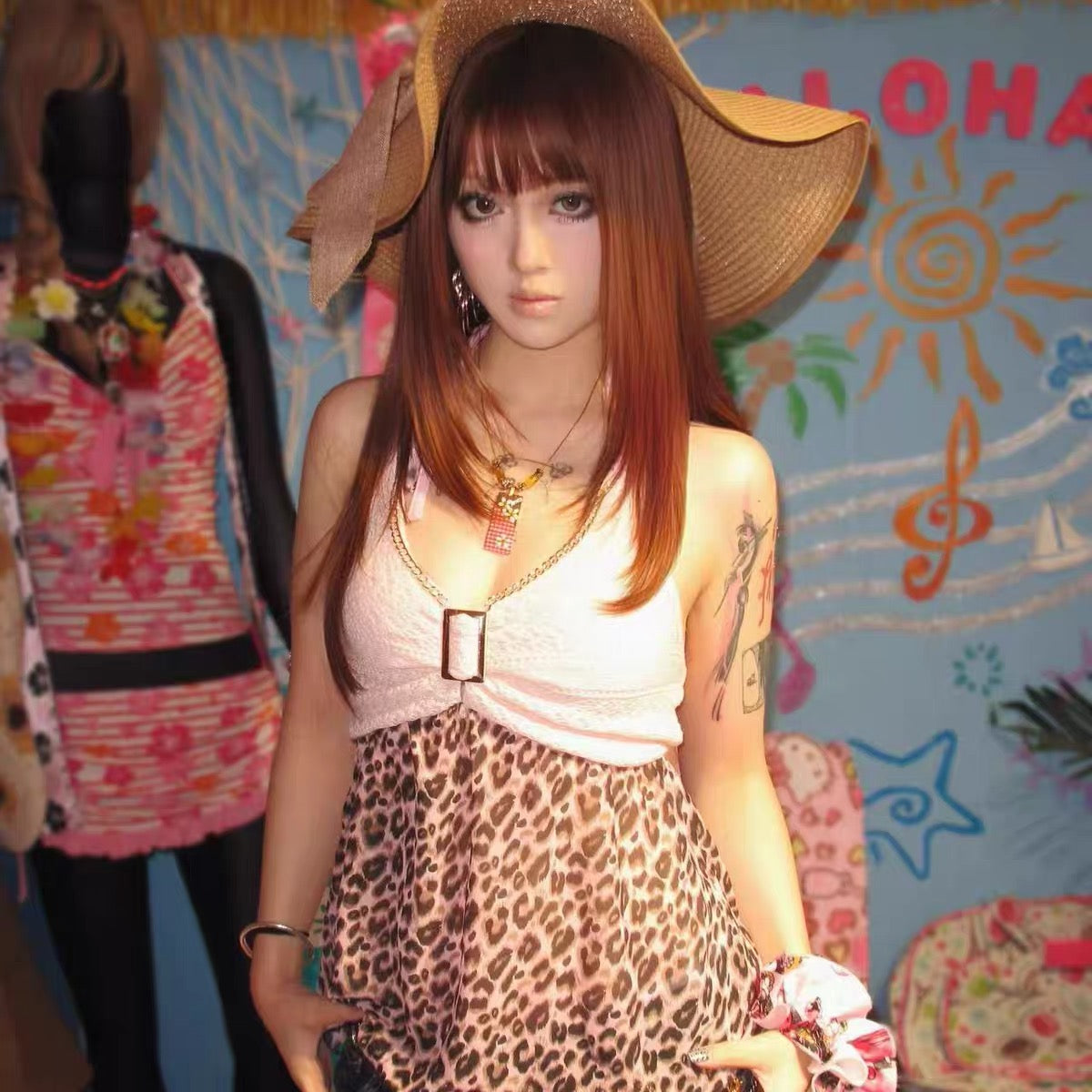 Karisuma leopard-print halter top styled with a wide-brim hat