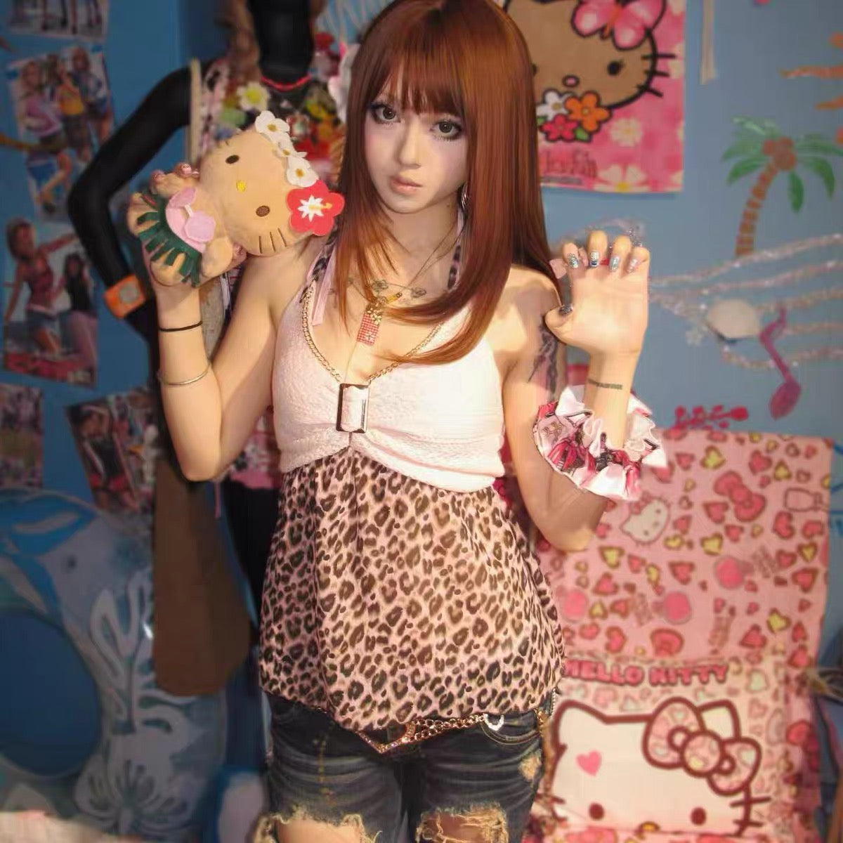 Front view of the Karisuma leopard-print halter top worn with denim shorts
