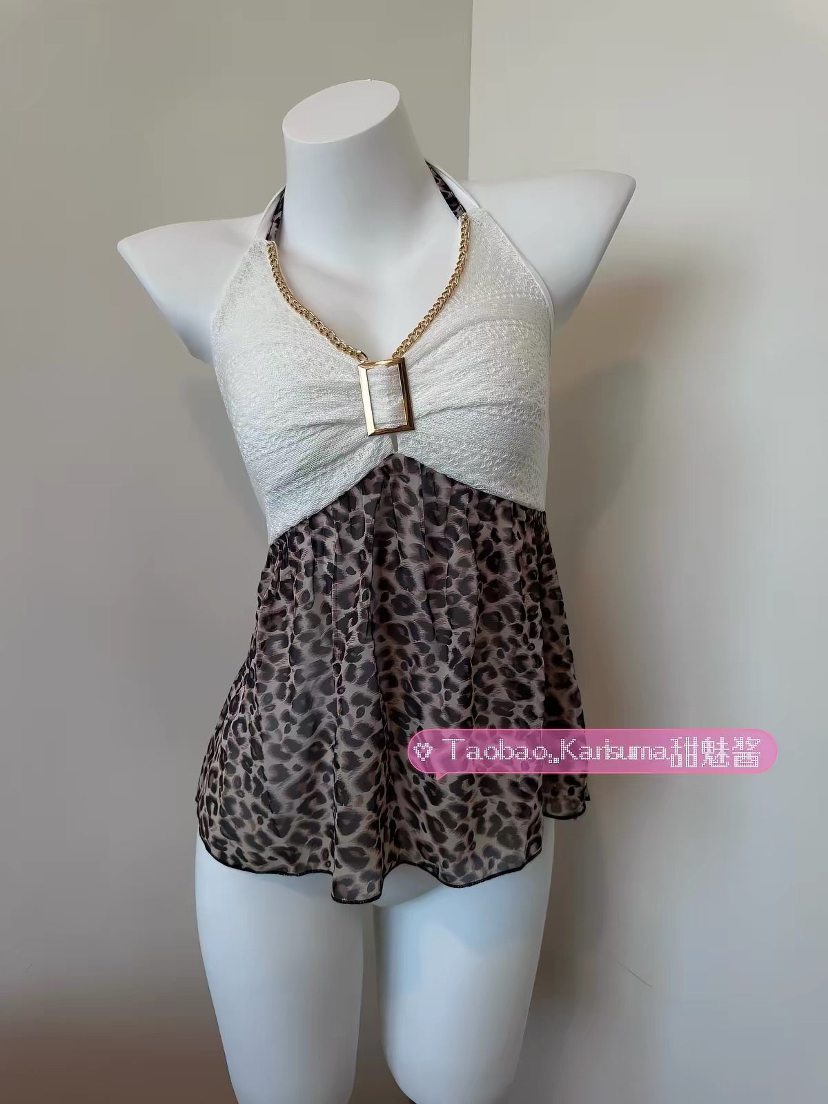 Karisuma leopard-print halter top with a white gathered bodice and gold-tone chain trim on a mannequin