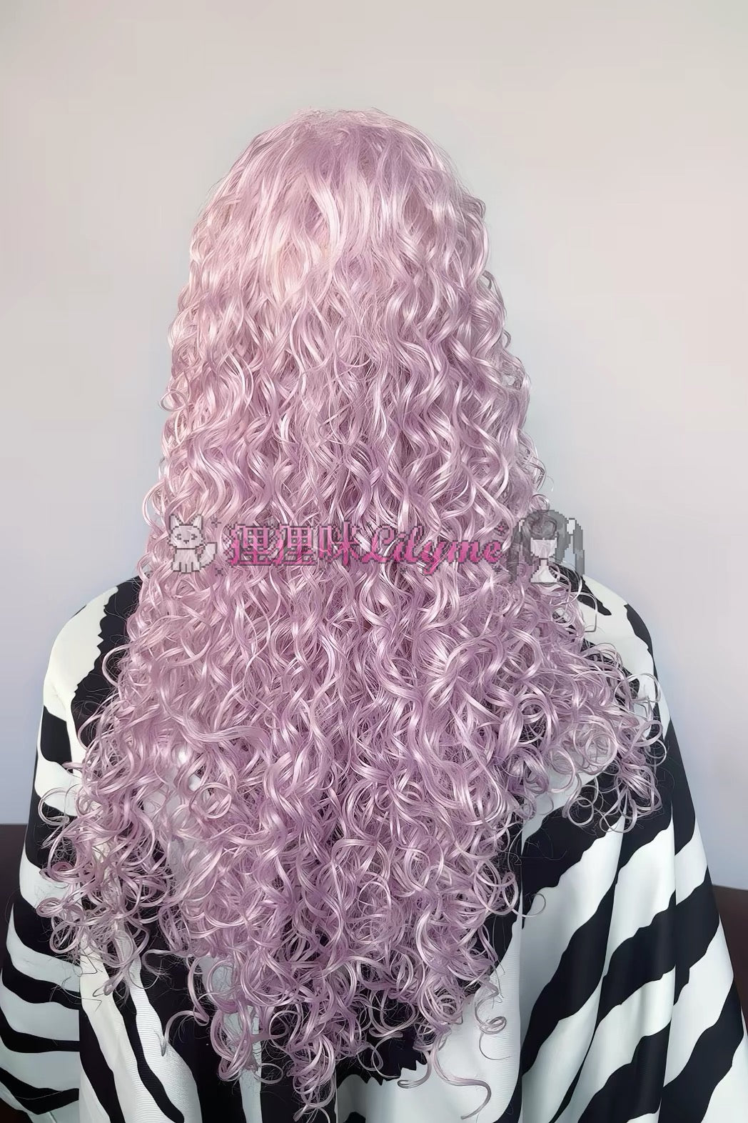 Back view of long lavender-pink curly wig