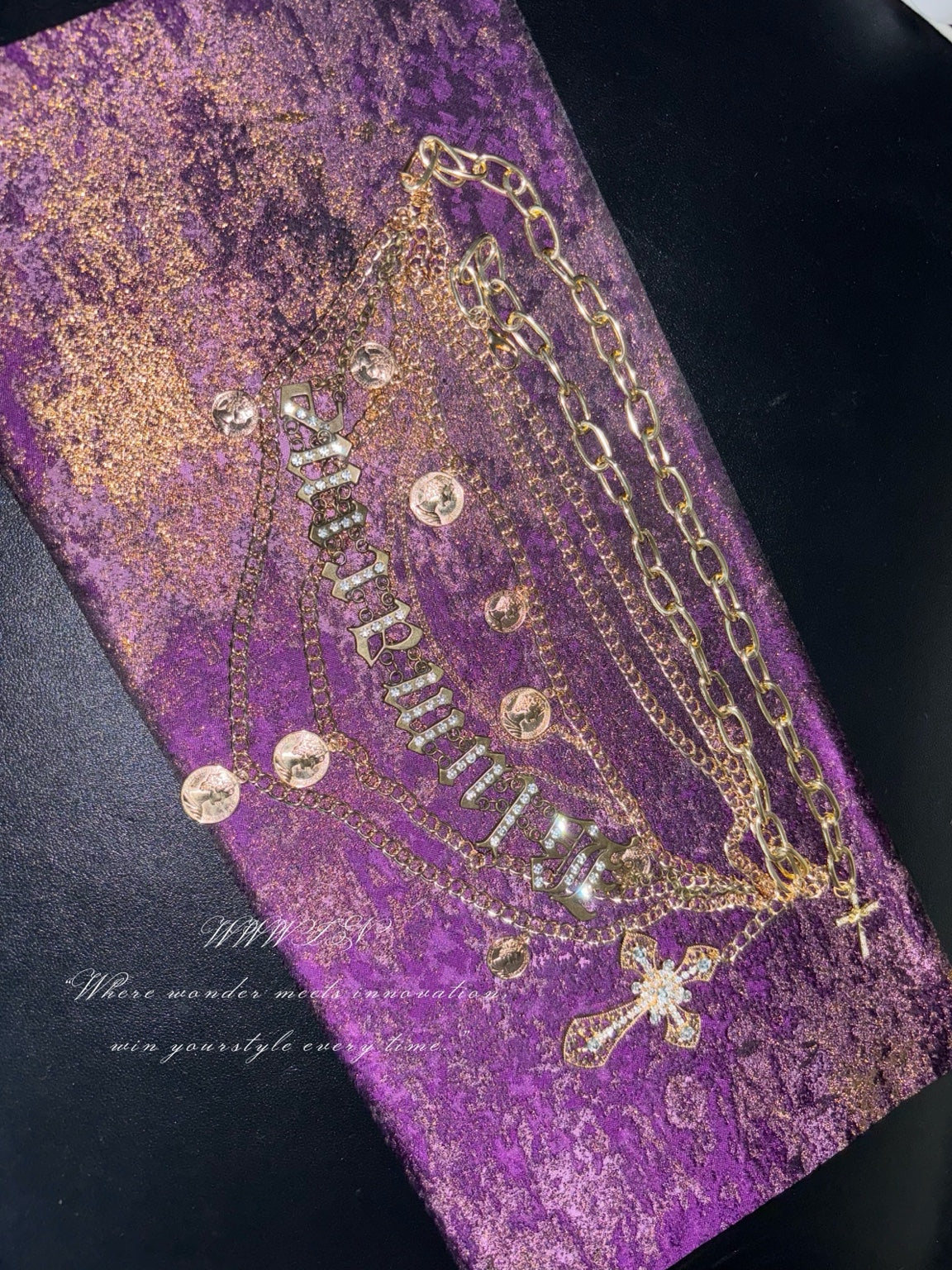 Layered gold-tone pendant belt flat lay