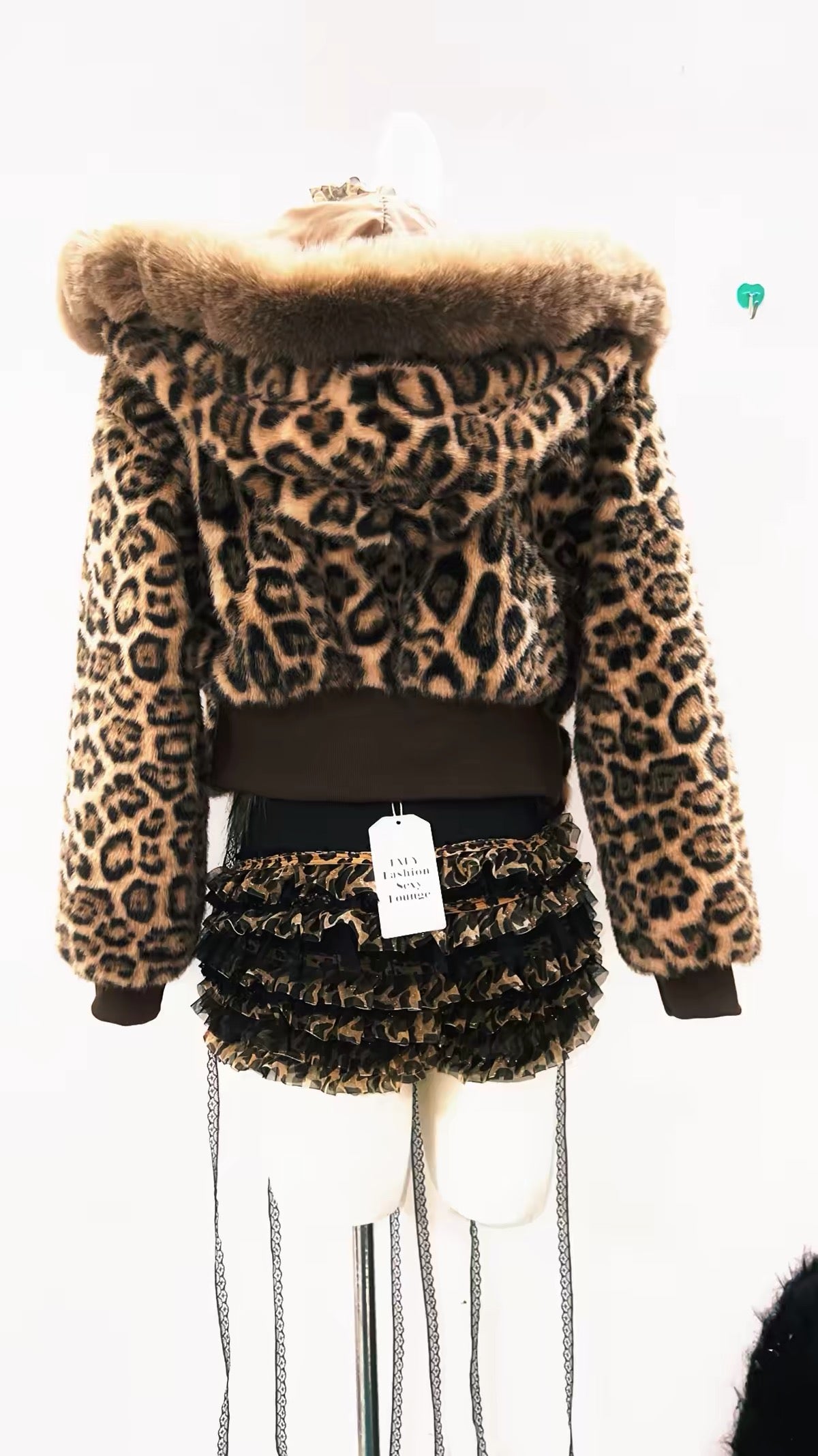 Back view of leopard print hooded jacket with ruffled shorts