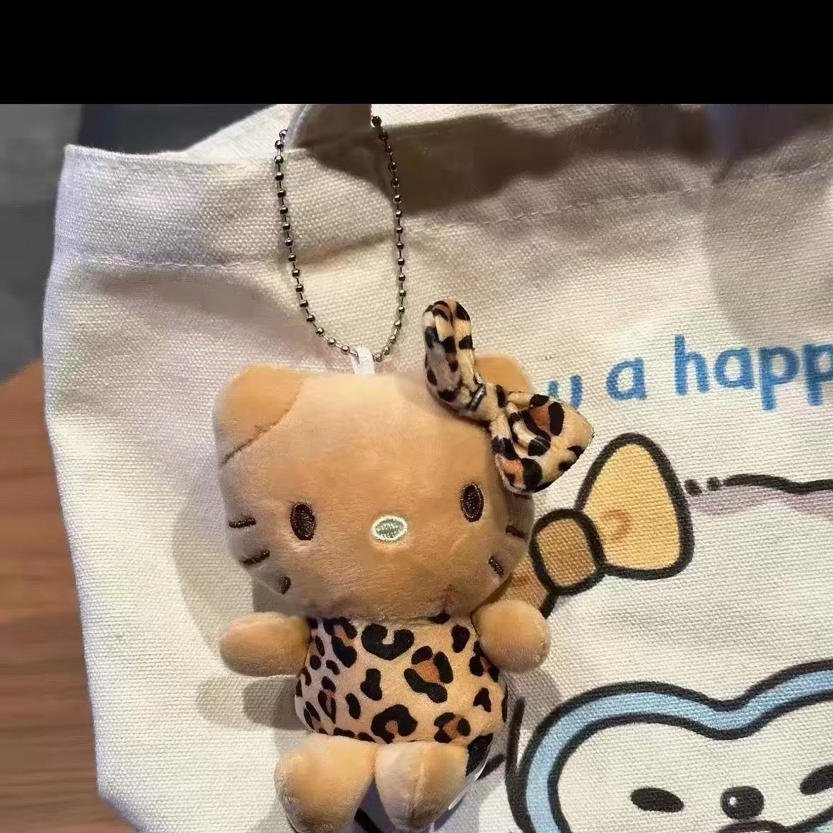 Leopard kitty plush charm with bow
