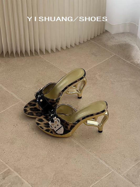 Leopard print mule heels with black buckle strap