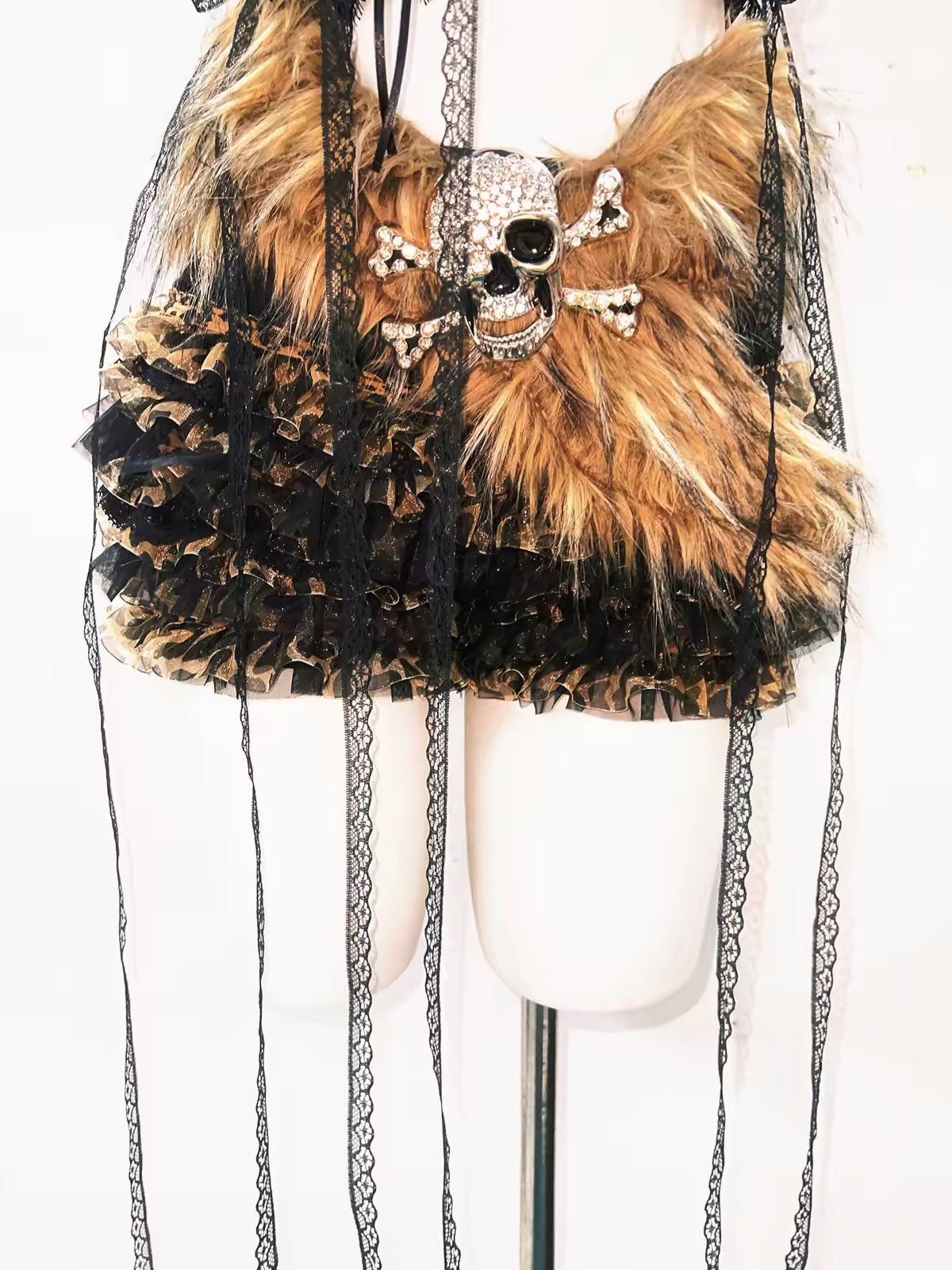 Ruffled black and leopard shorts with skull and fur belt detail