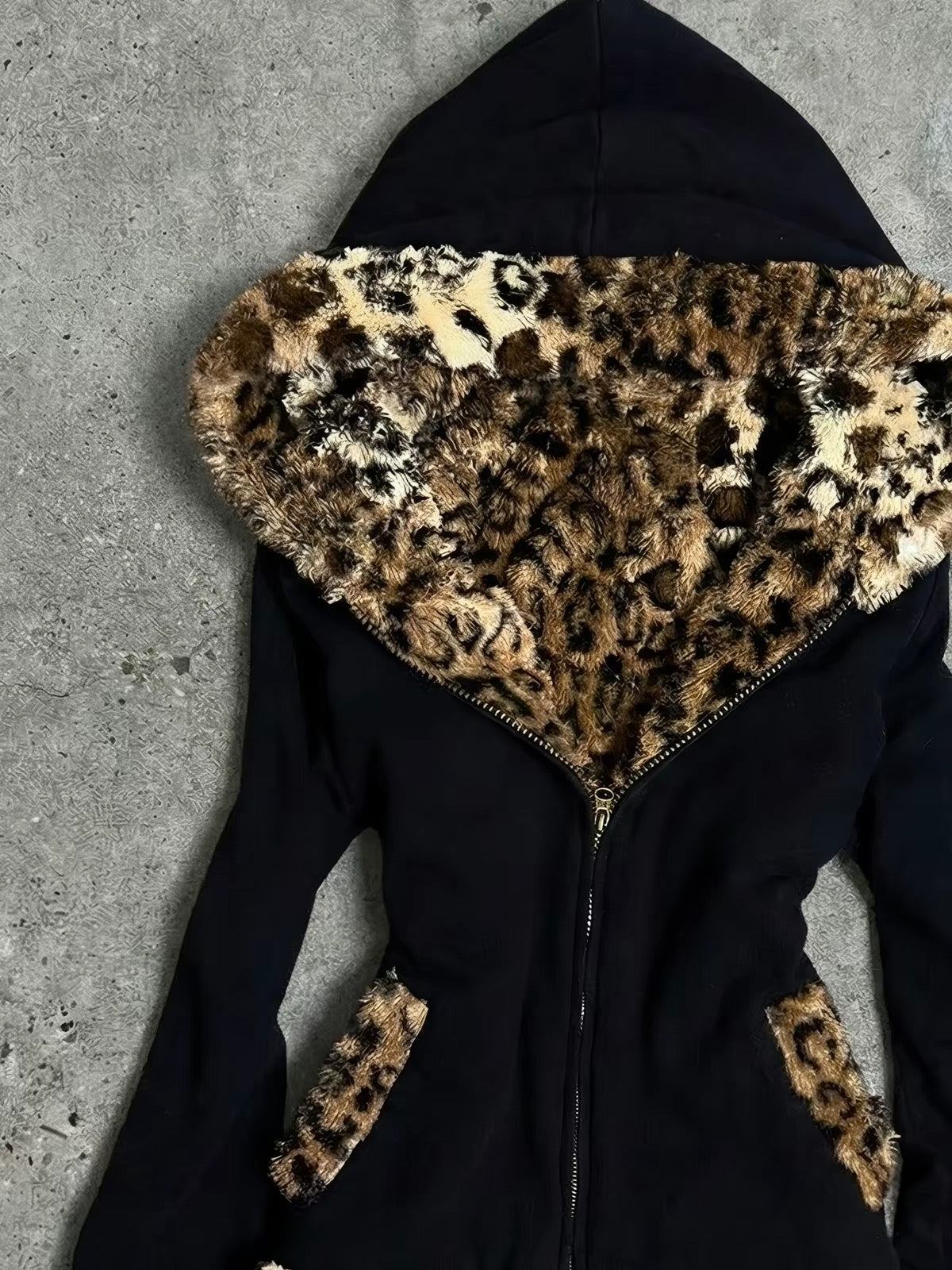 Oversized leopard faux-fur hood trim on black jacket