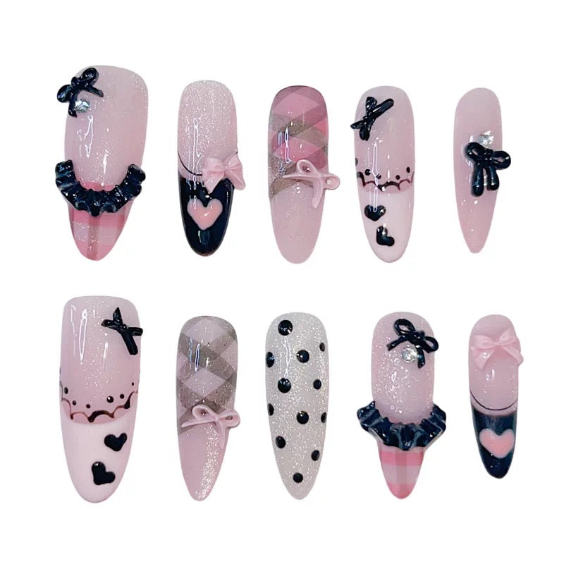 Pink and black bow press-on nails clean product view