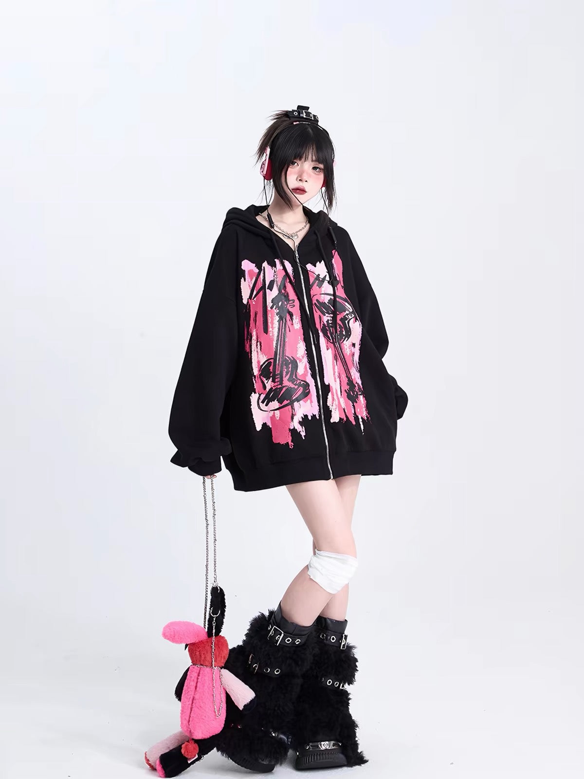 Oversized black hoodie with pink graphic styling