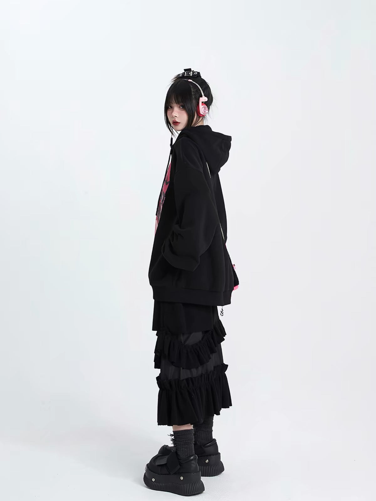Side view of oversized black graphic hoodie