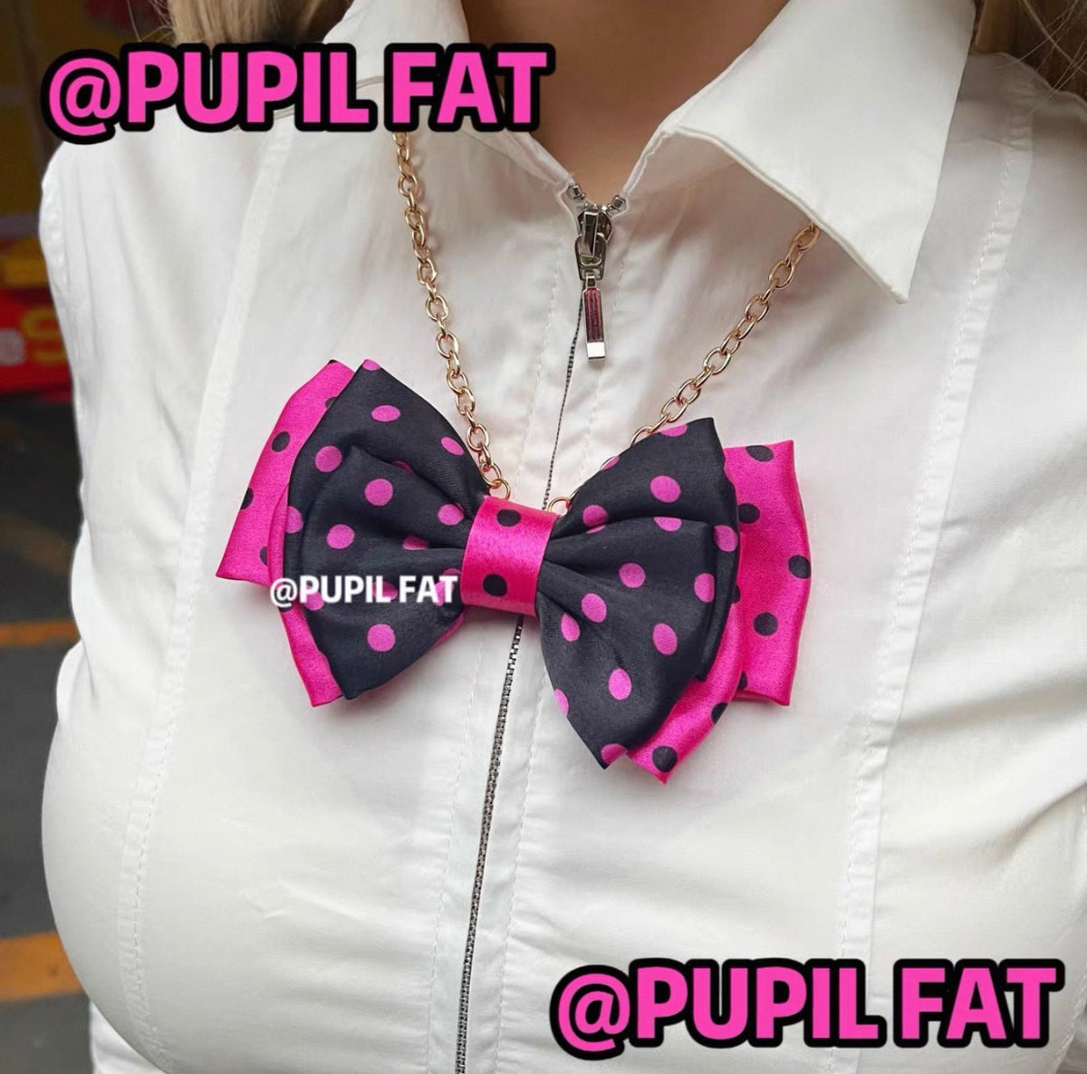 Black and hot pink polka dot bow necklace on gold-tone chain
