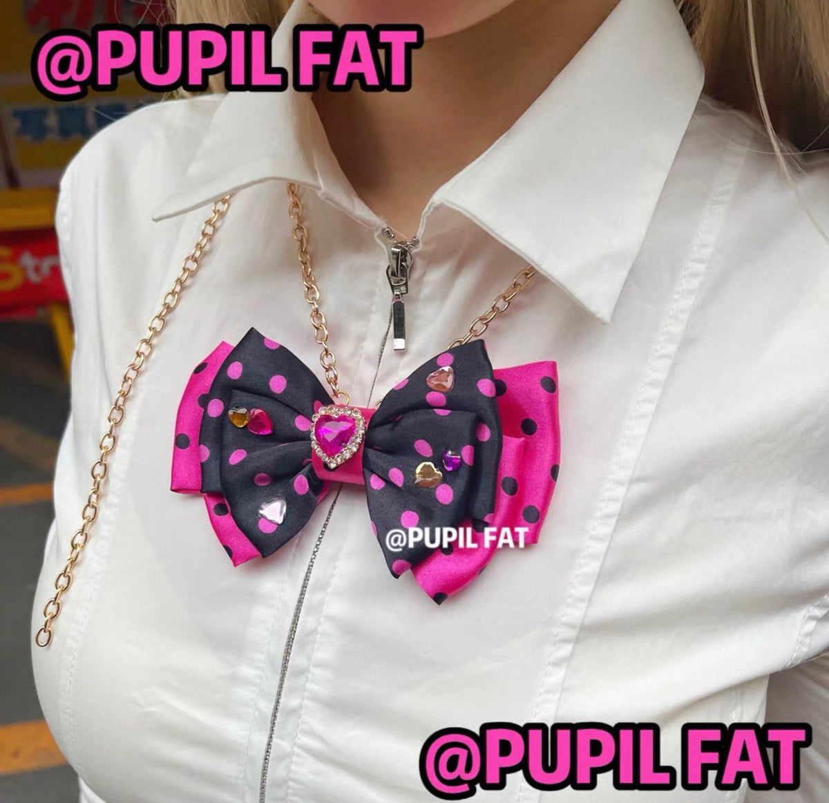 Black and hot pink polka dot bow necklace with rhinestone heart embellishments