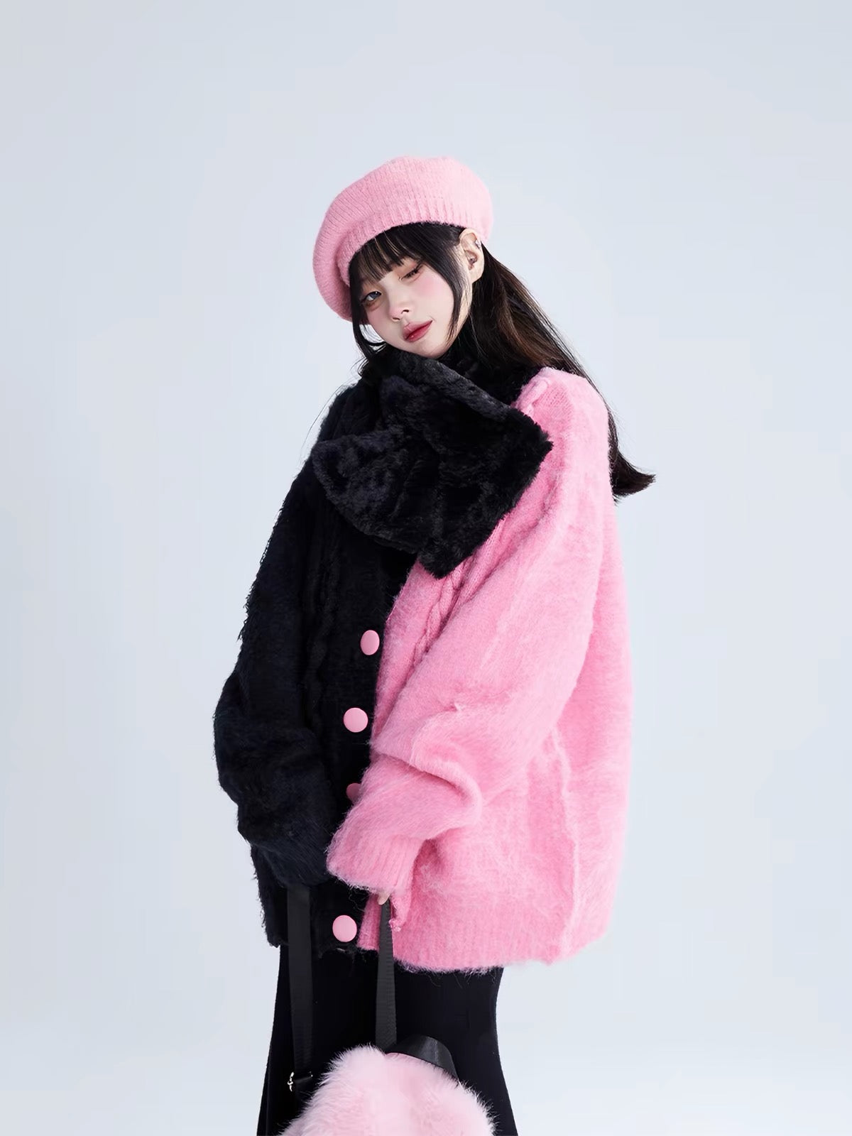 Pink and black split fuzzy cardigan styled with black scarf