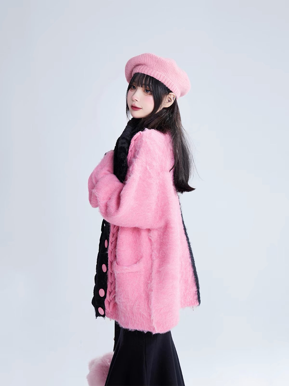 Pink and black split fuzzy cardigan side view
