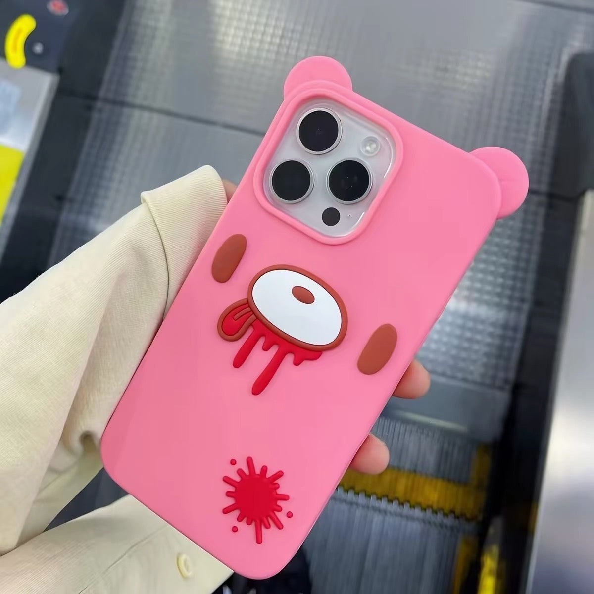 Pink bear silicone phone case shown in hand