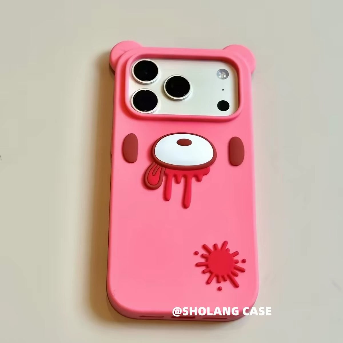 Pink silicone bear phone case with red graphic details