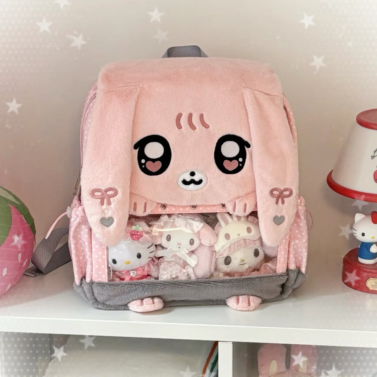Pink plush bunny display backpack front view