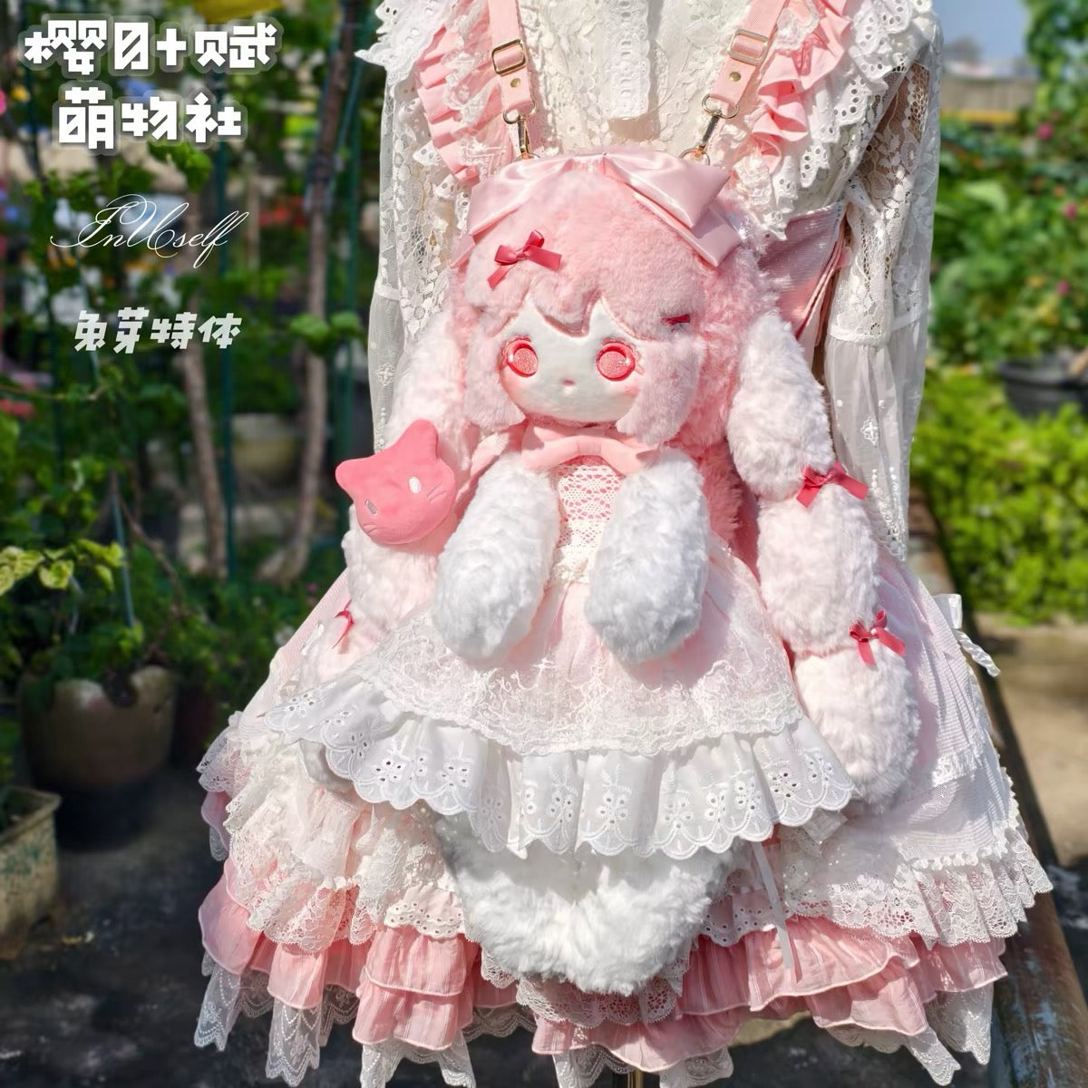 Pink bunny plush backpack front view