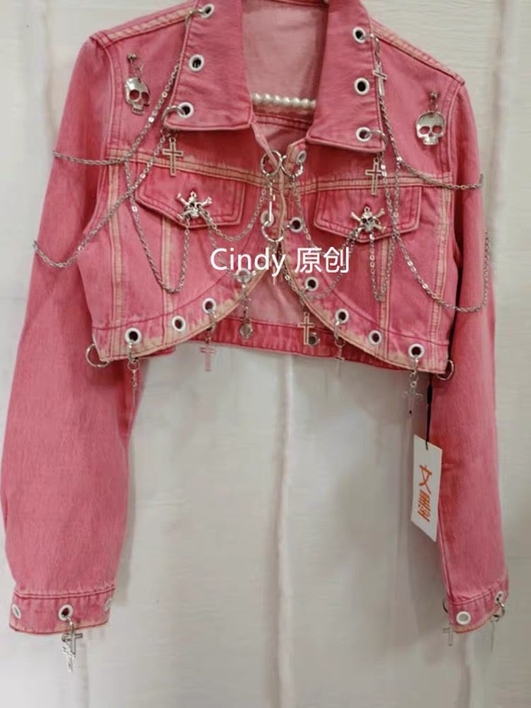 Pink cropped jacket with silver chain, cross and skull hardware details