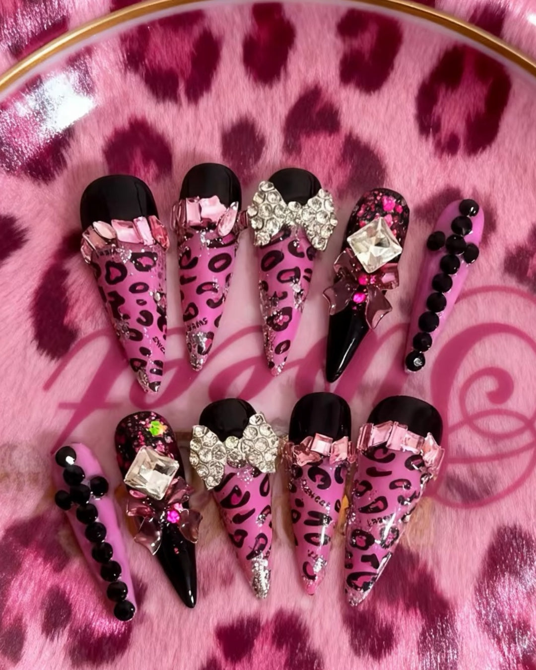 Pink leopard bow rhinestone handmade press-on nails on leopard background