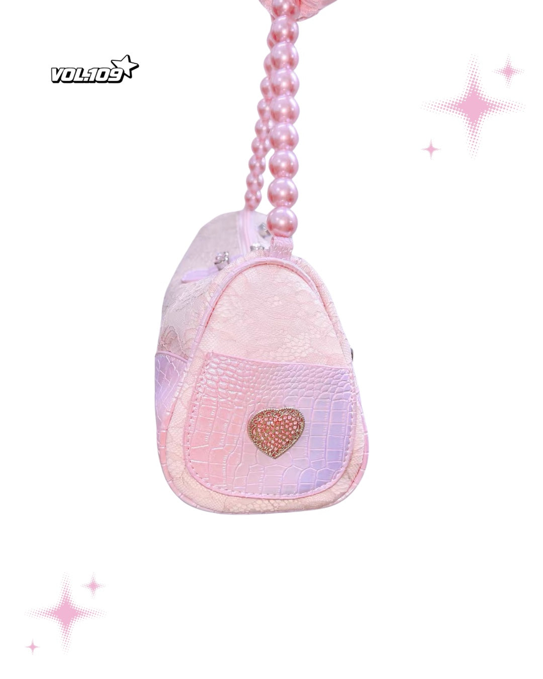 Pink pearl handle shoulder bag side view with heart detail